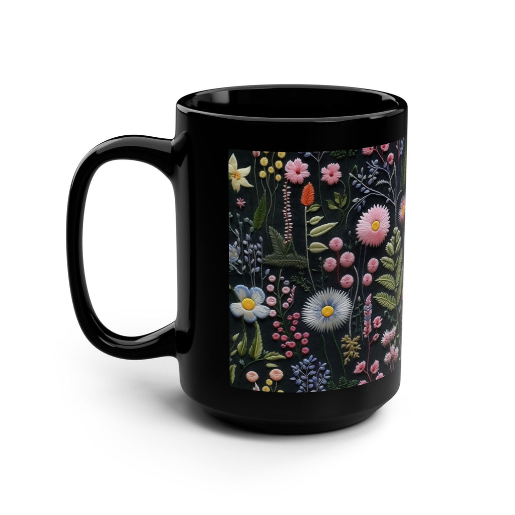 Black mug with floral design on a white background