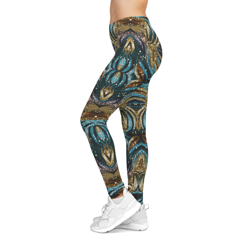 Leggings with a peacock feather pattern worn by a person on a white background