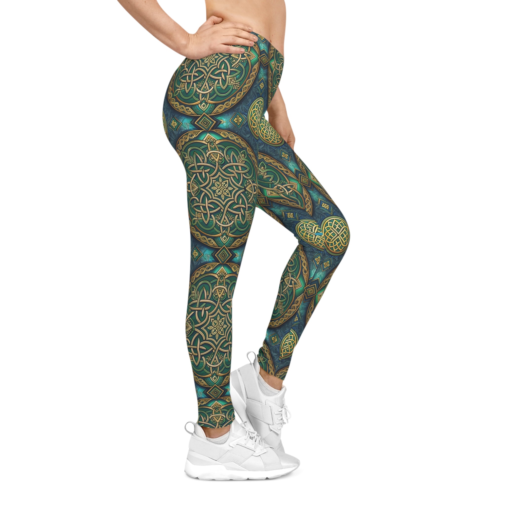 Leggings with a Celtic green and gold pattern worn by a person on a white background