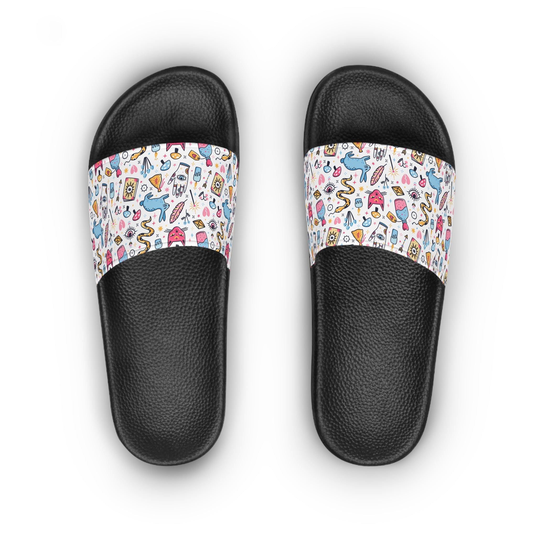 Black slides with colorful patterned straps on a white background