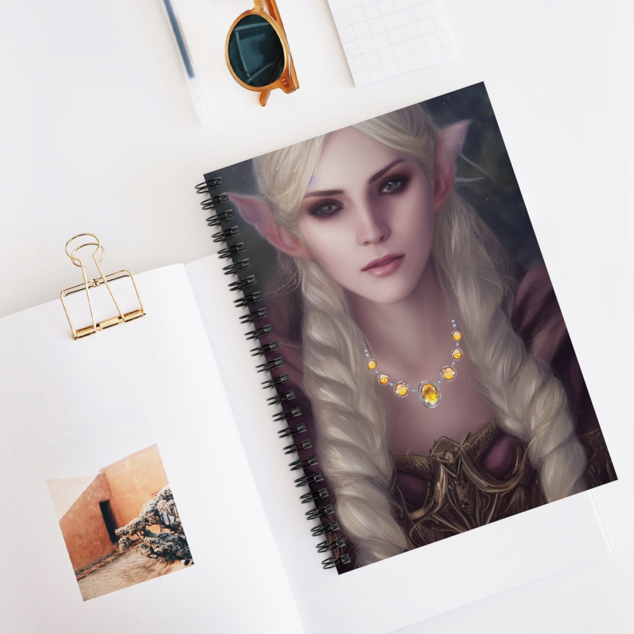 Notebook with an elf illustration on a white surface