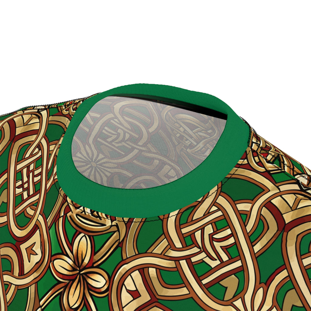 Close-up of a green and gold patterned product with a reflective surface.