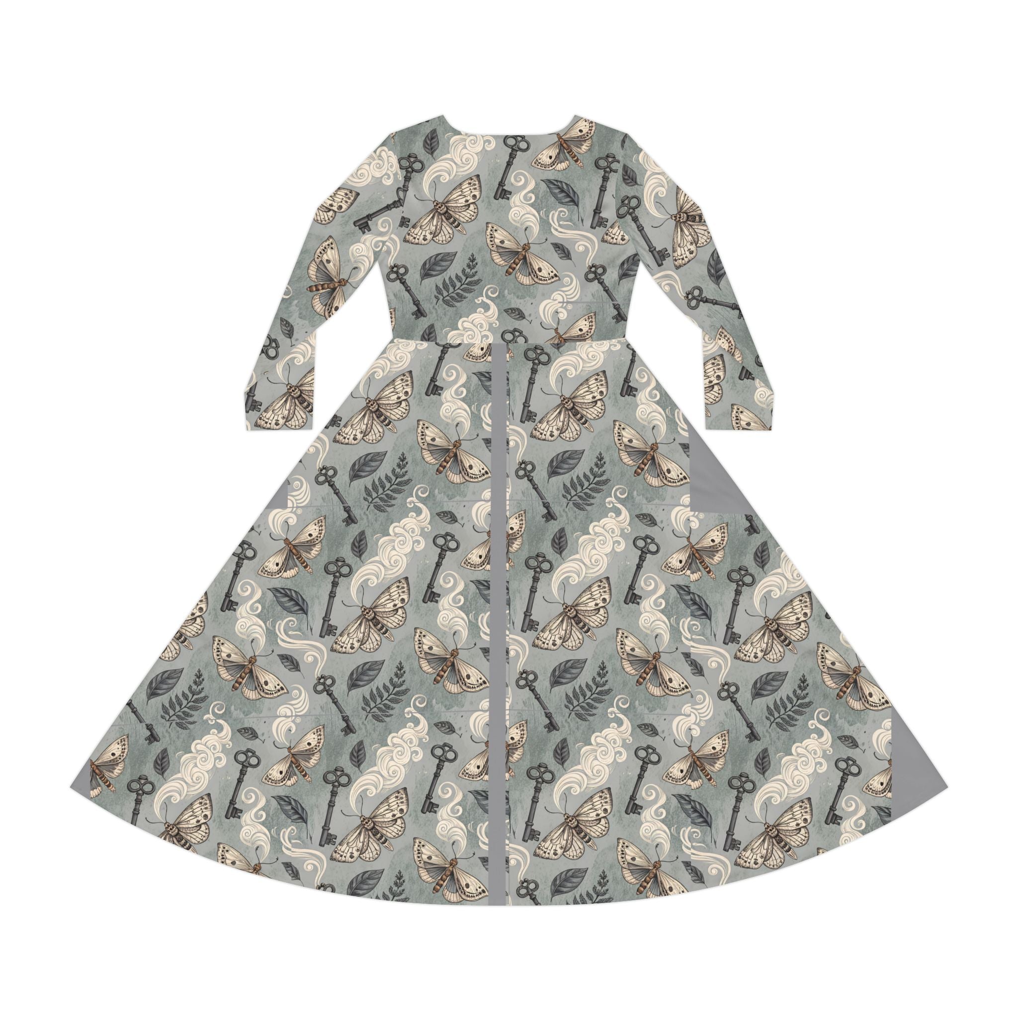Dress with moth and key pattern on a gray background