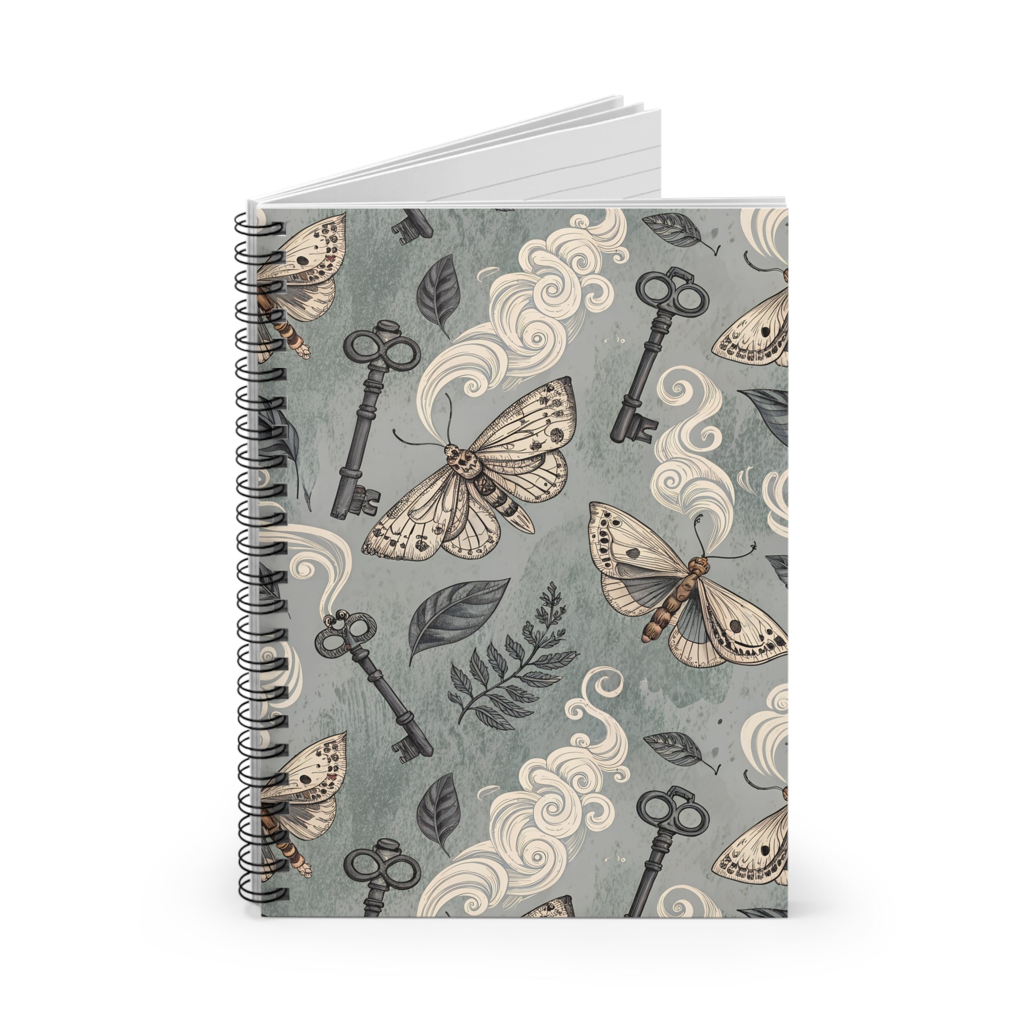 Notebook with moth and key design on a gray background
