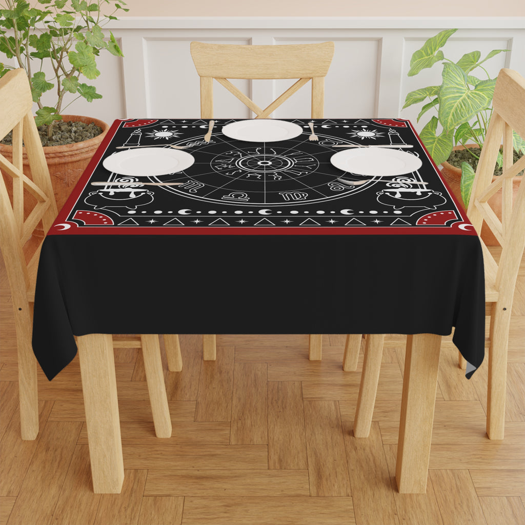 Decorative tablecloth with astrological symbols on a black background