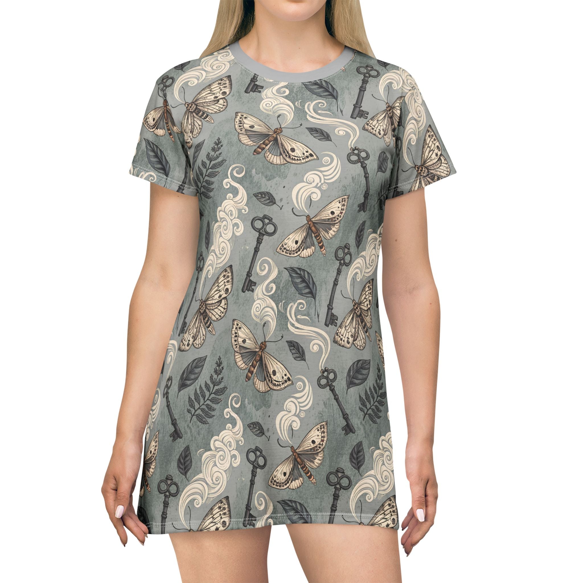 T-shirt with moth and key pattern worn by a model on a white background