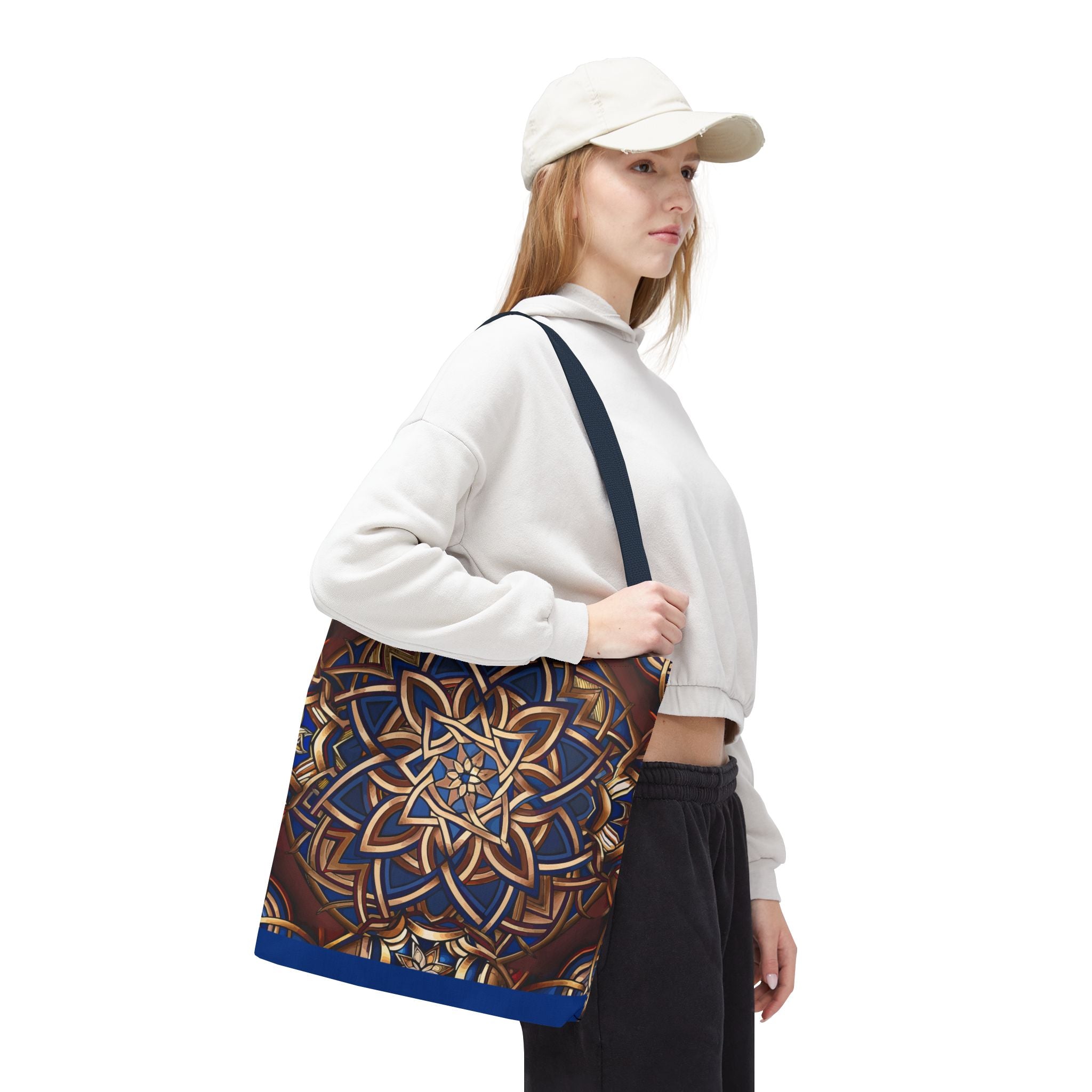 Woman holding a tote bag with a Celtic design on a white background