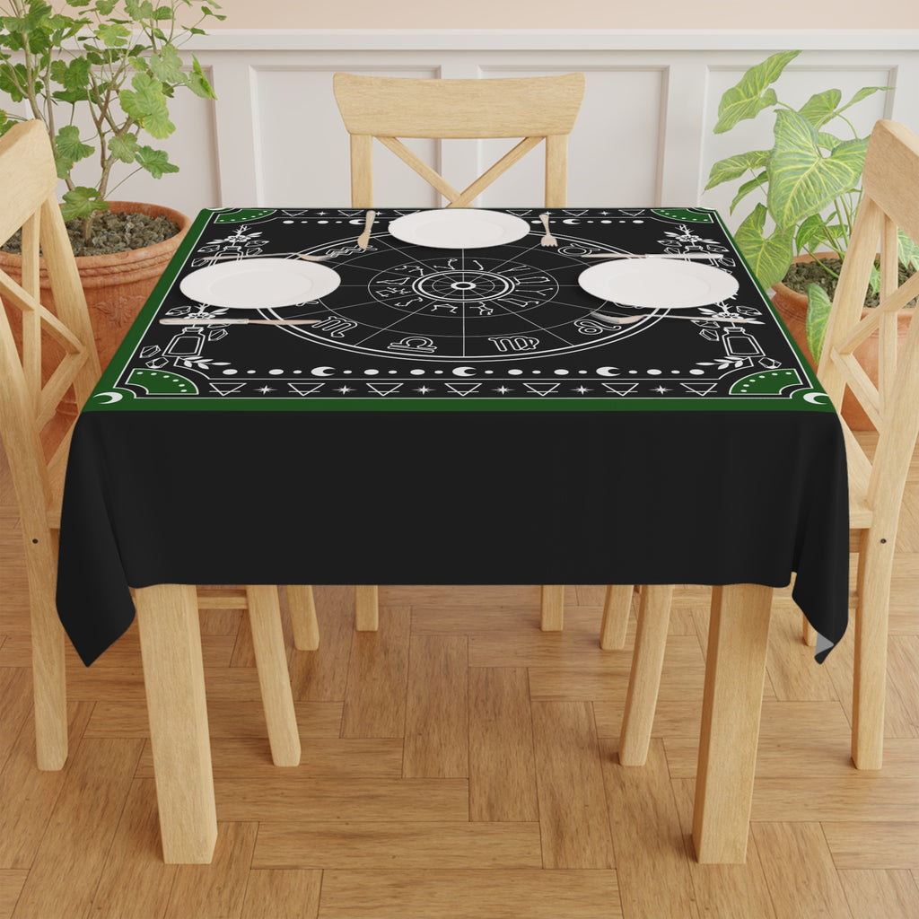 Decorative tablecloth with astrological symbols on a black background