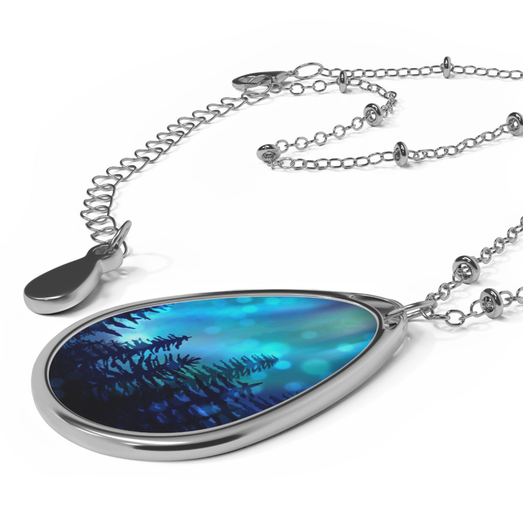 Teardrop-shaped pendant with blue and purple design on a silver chain against a white background