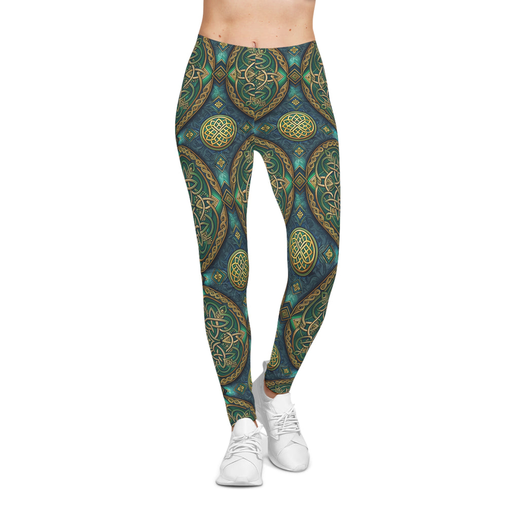 Leggings with a Celtic green and gold pattern worn by a person on a white background