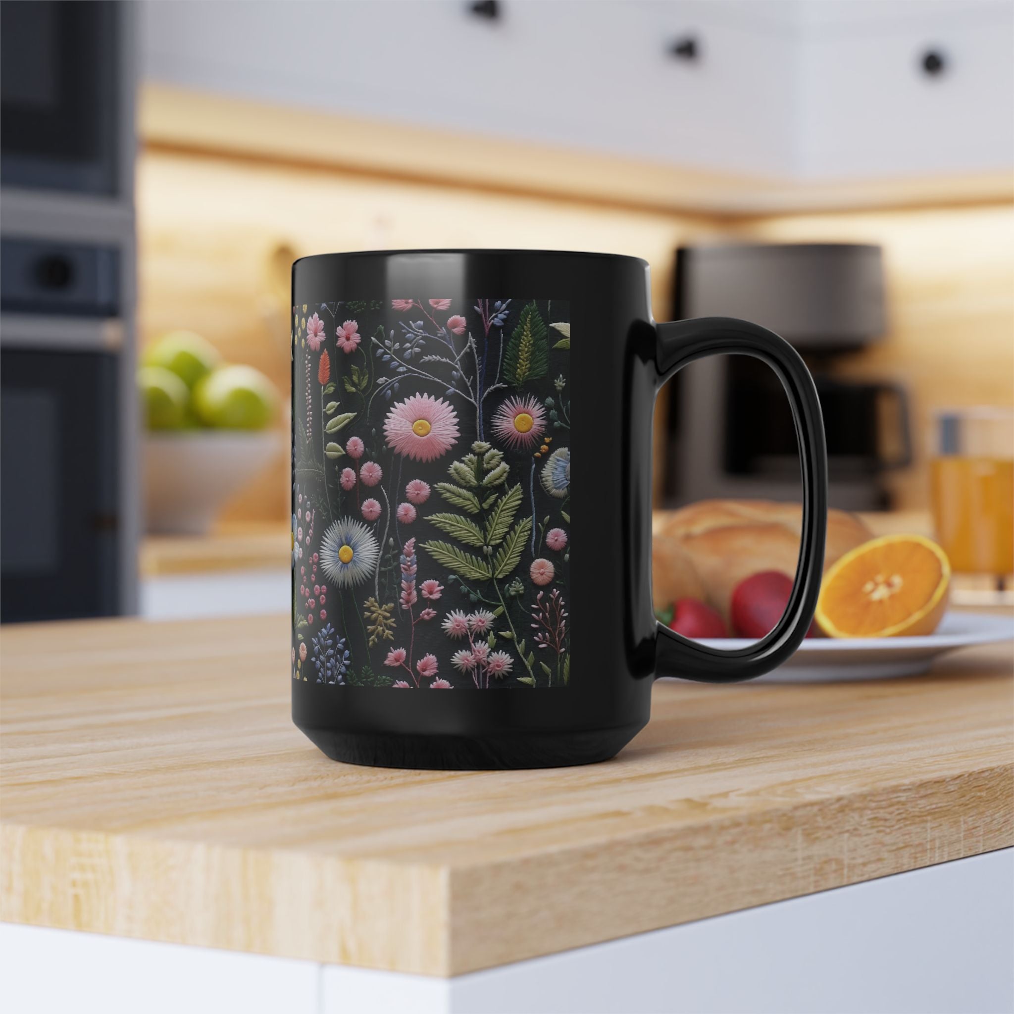 Black mug with floral design on a kitchen counter