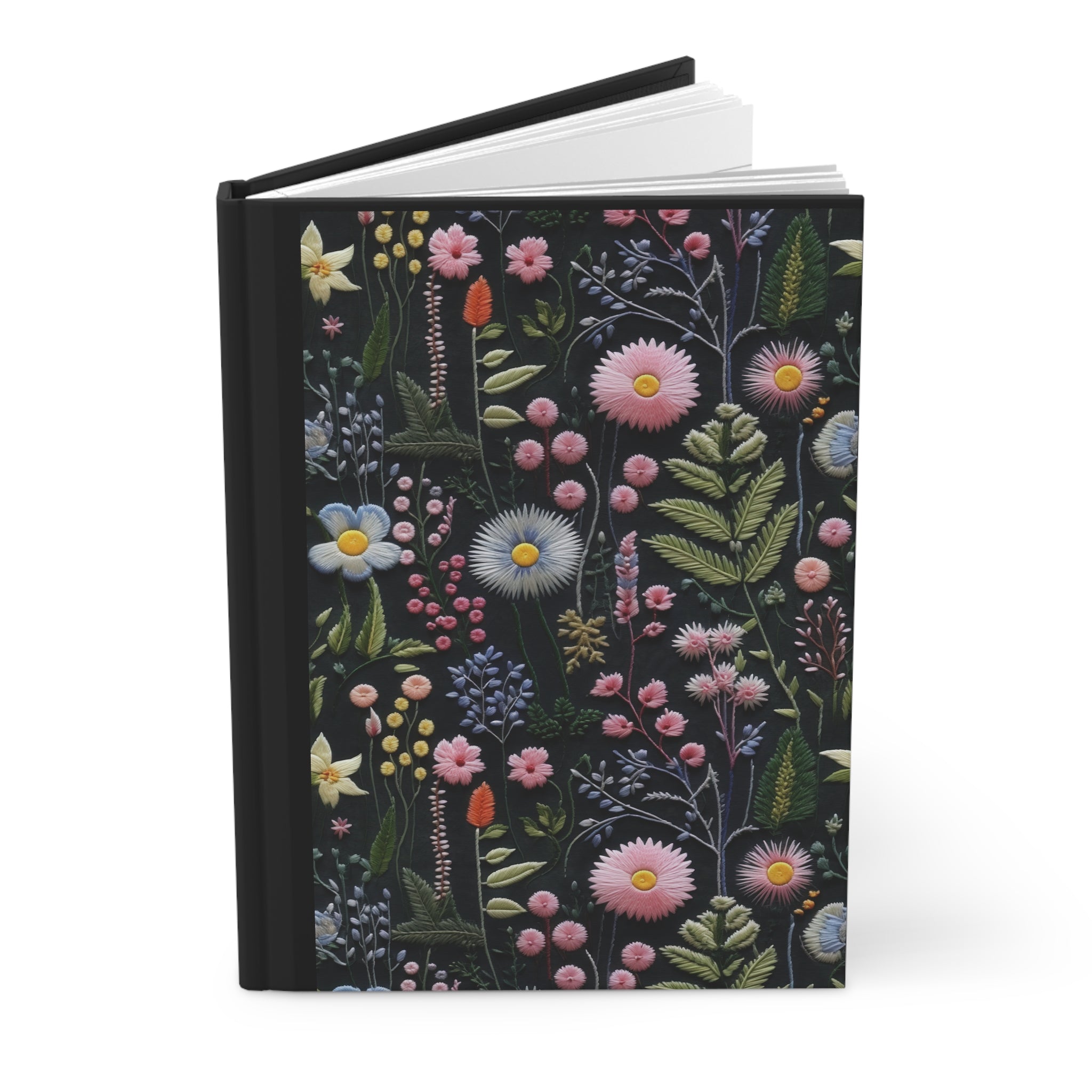 Notebook with floral design on a black background