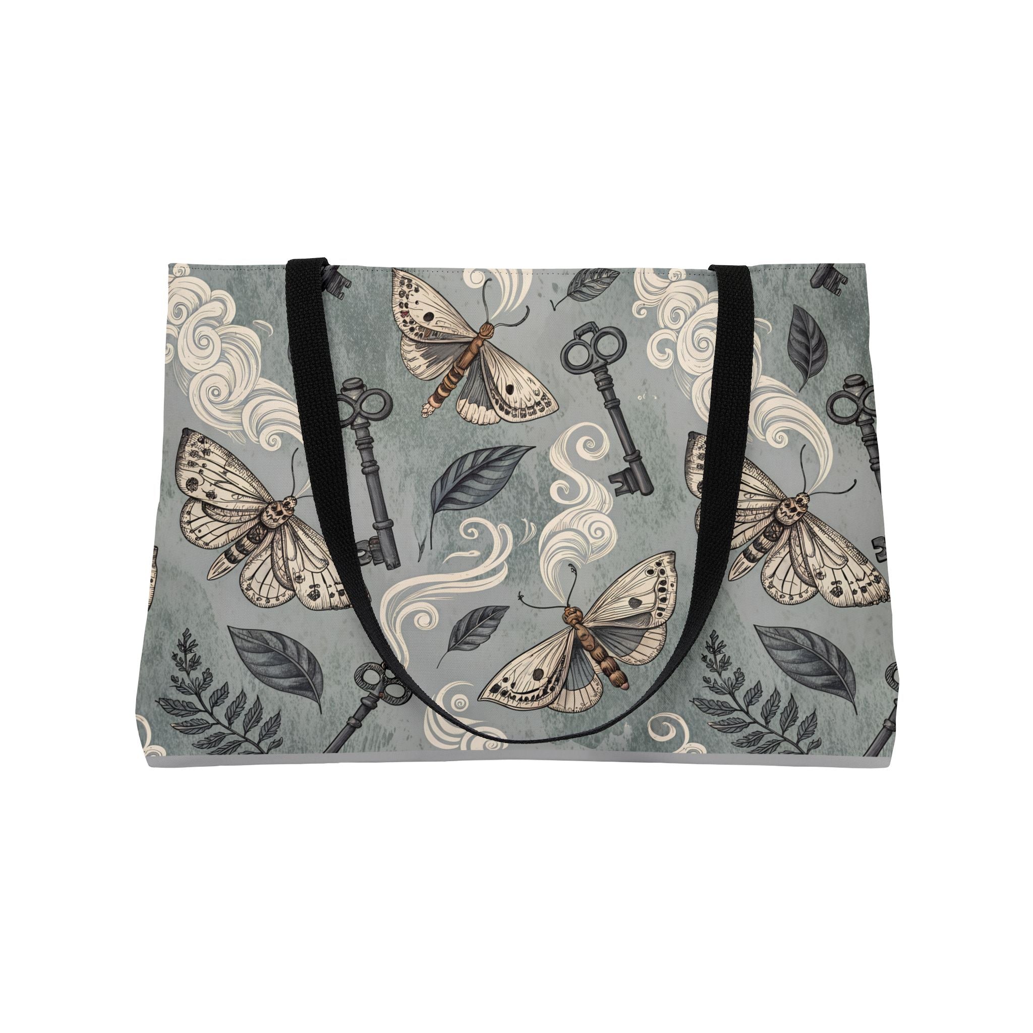Tote bag with moth and key pattern on a gray background