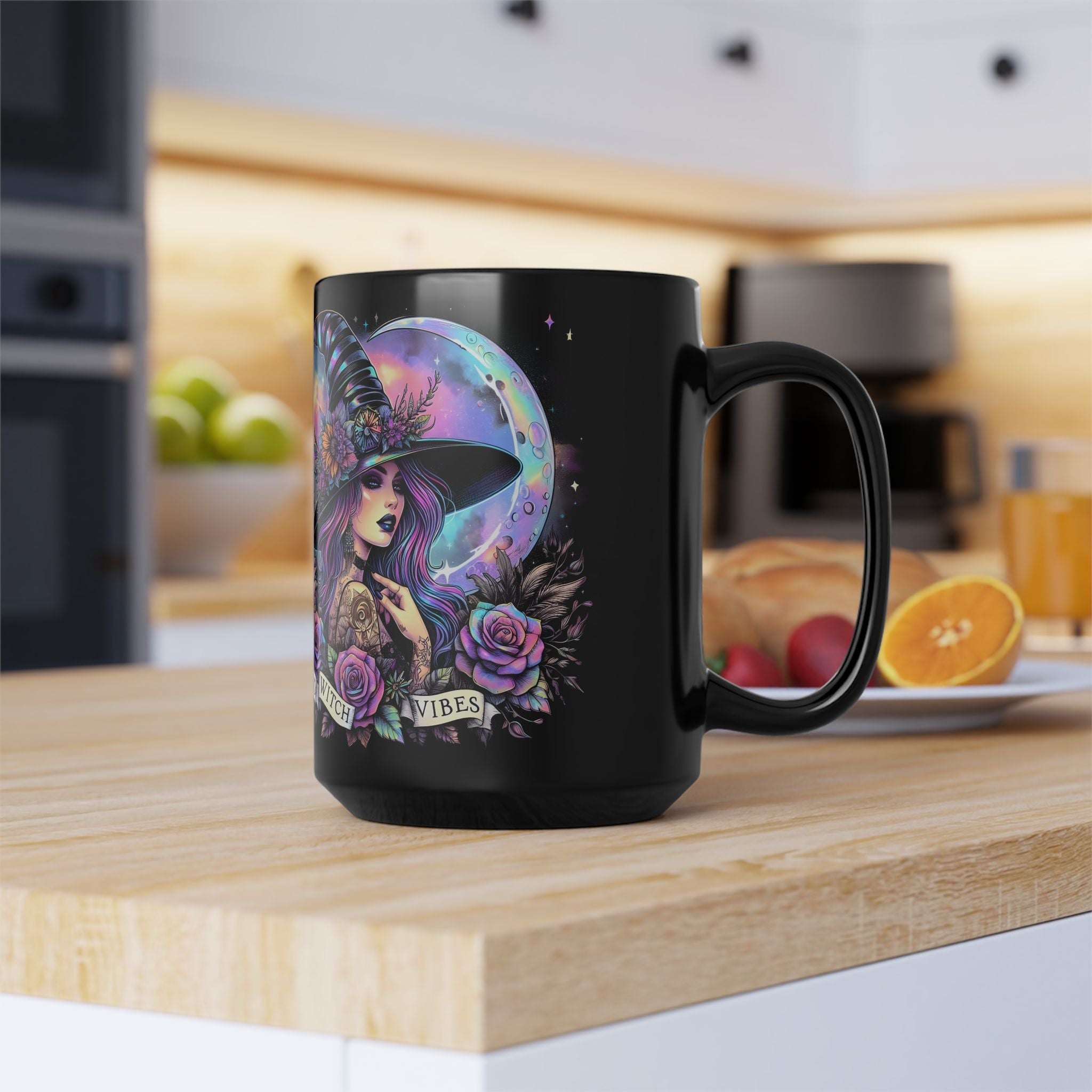 Black mug with a colorful witch design on a kitchen counter